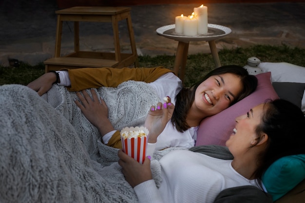 Young friends having fun at cinema in open air