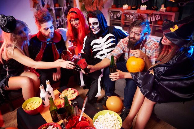 Young friends having fun at Halloween party