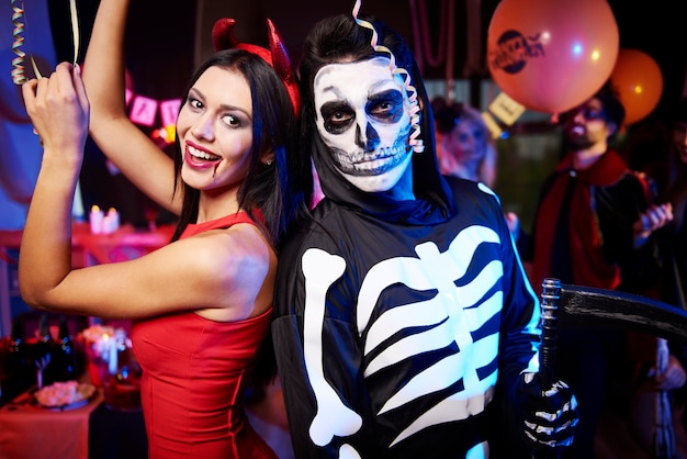 Young friends having fun at Halloween party