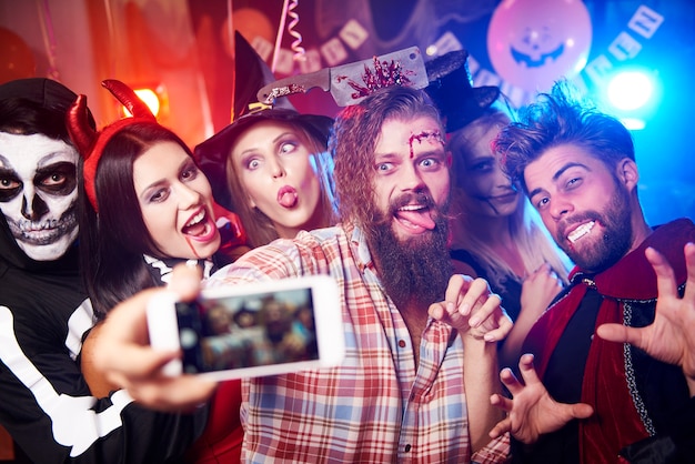 Young friends having fun at Halloween party