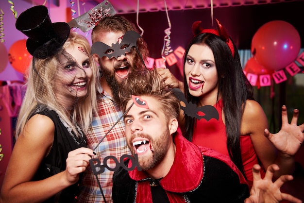 Young friends having fun at Halloween party