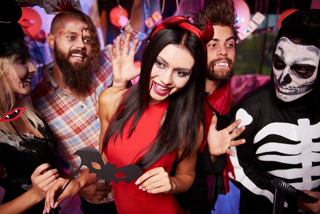 Young friends having fun at Halloween party