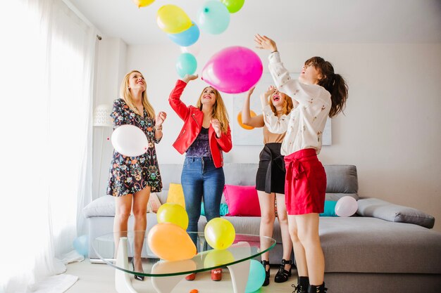 Young friends playing with balloons