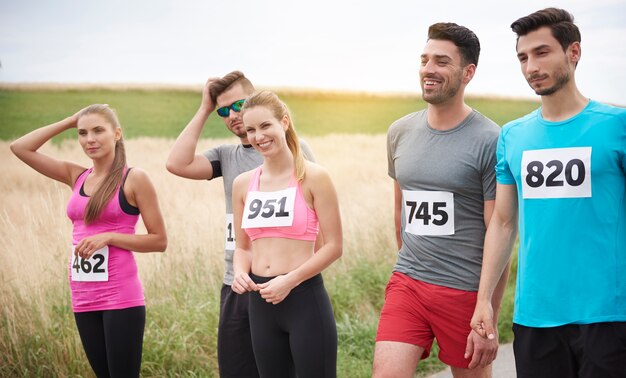 Young friends running during a marathon