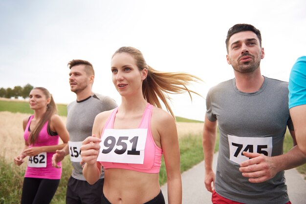 Young friends running during a marathon