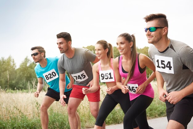 Young friends running during a marathon