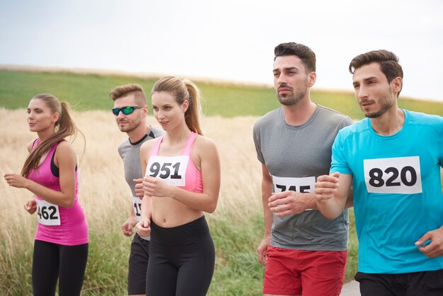 Young friends running during a marathon