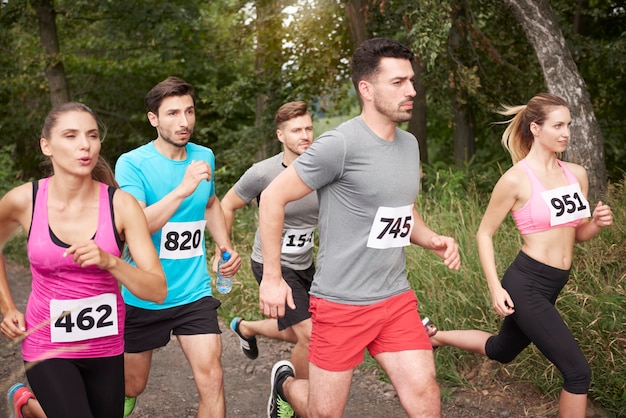 Young friends running during a marathon