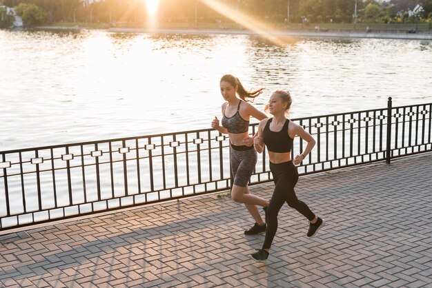 Young friends running in the park