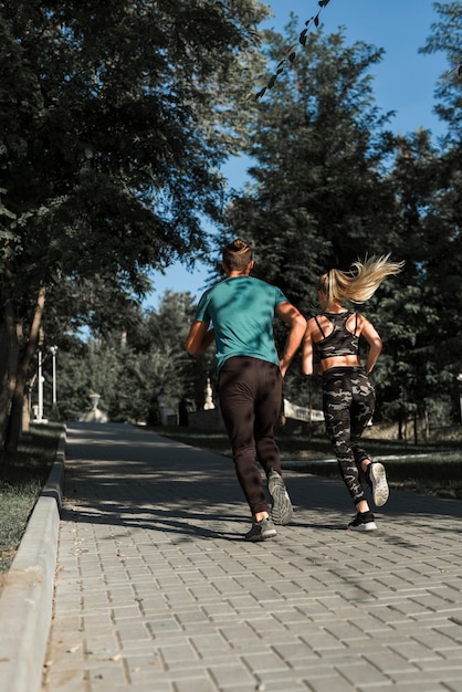 Young friends running in the park