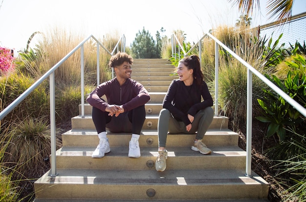 Young friends sitting on stairs