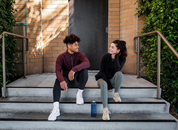 Young friends sitting on stairs