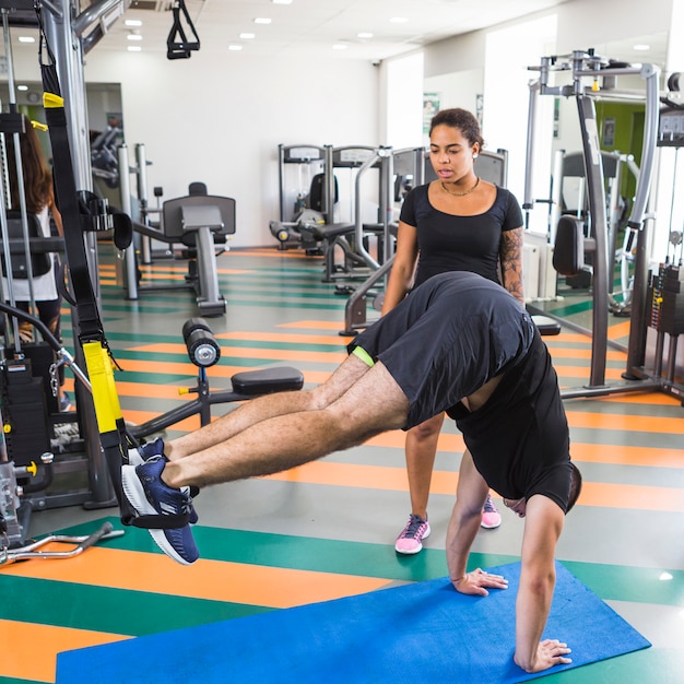 Young friends training in the gym