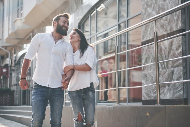 A young funny loving couple have fun on a sunny day.