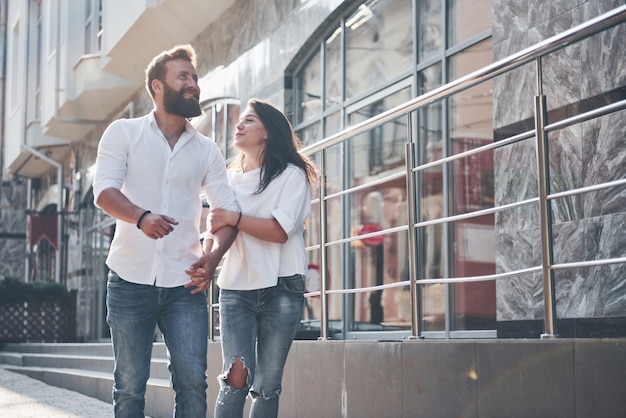 A young funny loving couple have fun on a sunny day.