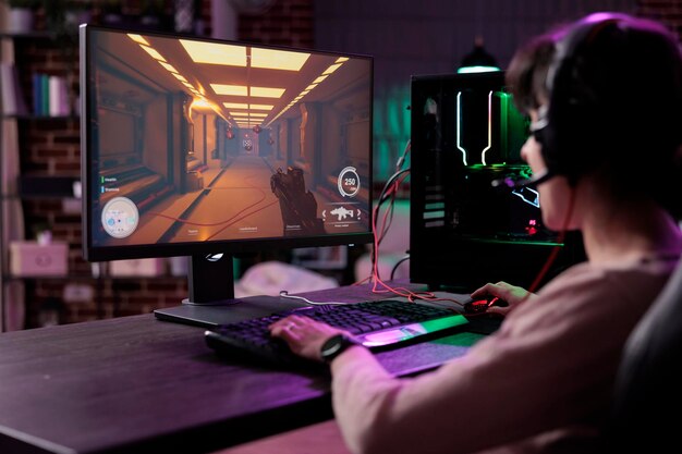 Young gamer having fun with action video games competition, playing online game championship. Caucasian woman enjoying rpg play tournament on live stream, gaming on modern computer.