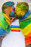 Free photo young gays kissing on holi festival