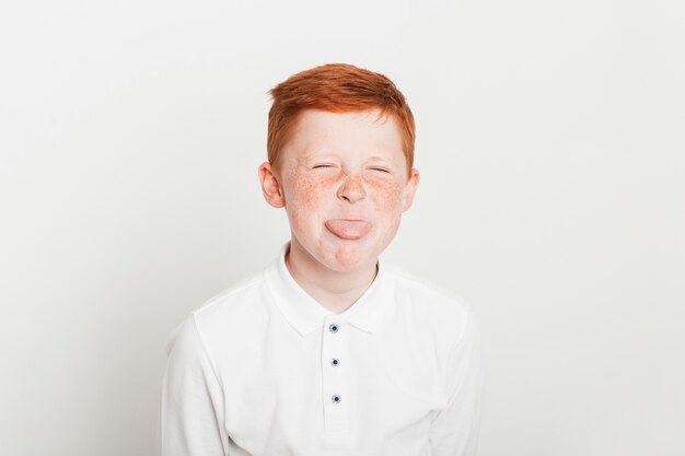 Young ginger boy fooling around