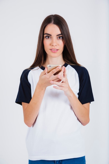 Young girl amazed with her smartphone