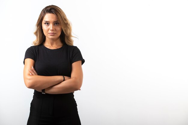 Young girl in black sport outfits feels confident.