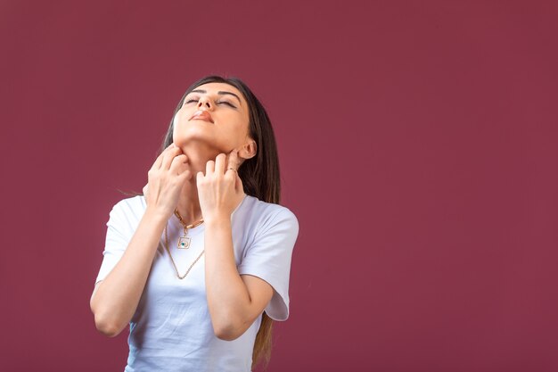 Young girl doing dreaming or praying gest in hand