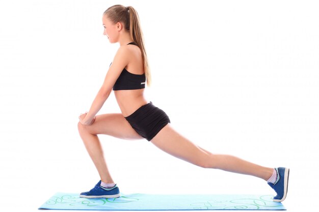 Young girl doing streching exercises