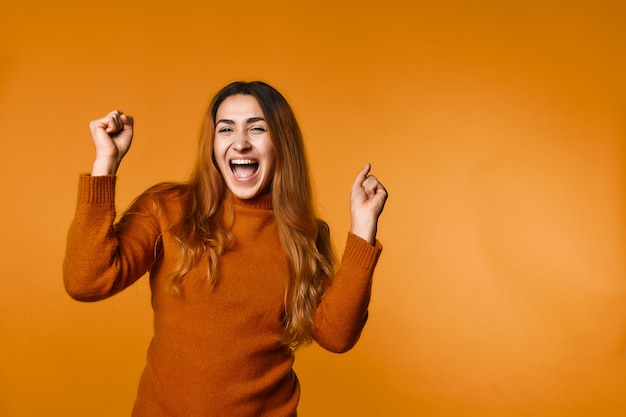 Young girl has cheering look standing