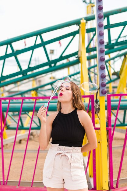 Young girl having fun in the amusement park