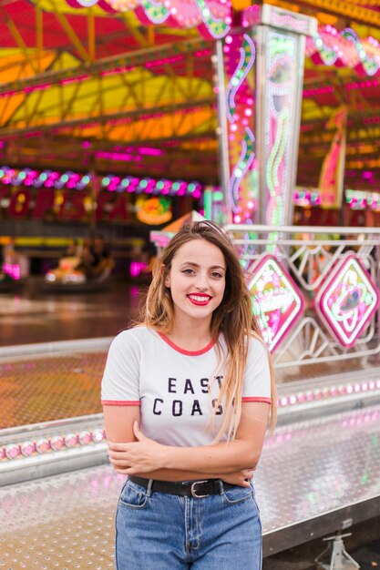 Young girl having fun in the amusement park