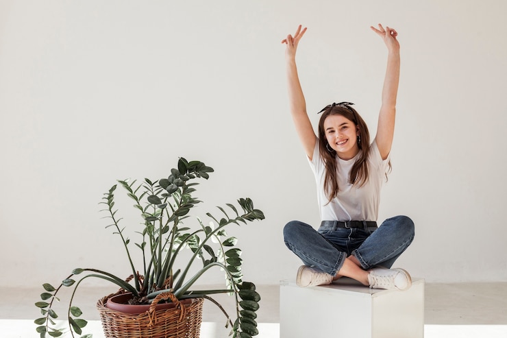 Free Photo young girl having her arms in the air