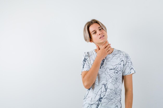 Young girl having sore throat on white background