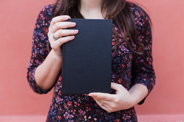 Young girl holding a book