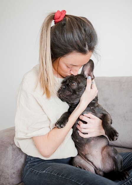 Young girl holding her cute puppie