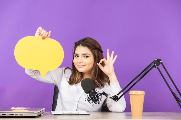 Young girl holding idea bubble and gesture OK High quality photo