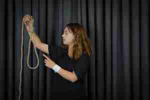 Free photo young girl holding suicide rope and saying no to it. high quality photo