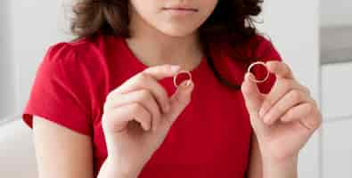 Free photo young girl holding wedding rings