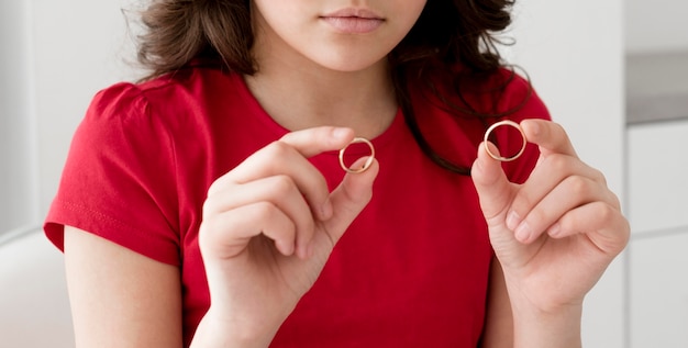 Young girl holding wedding rings