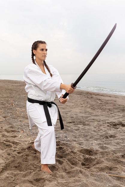 Young girl in karate outfit training