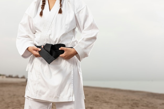 Young girl in karate uniform outdoor