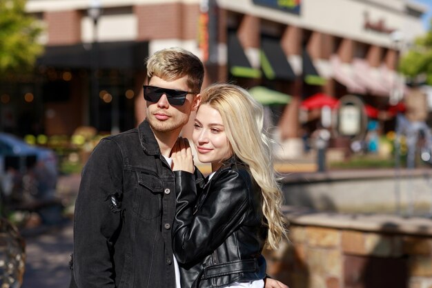 Young girl leaning on her boyfriend and looking away