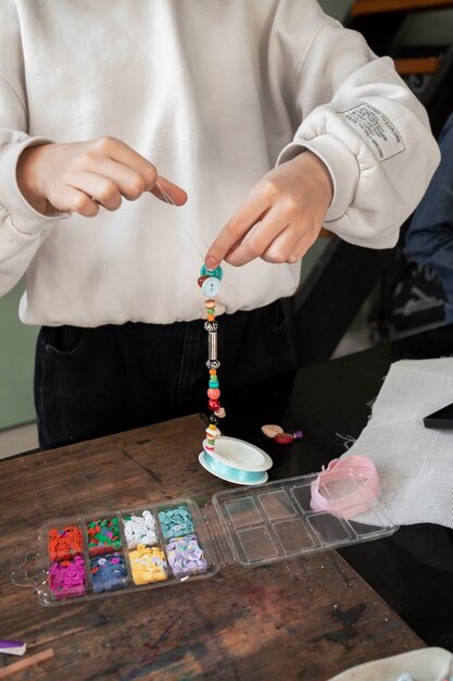 Young girl making diy crafts in upcycle project