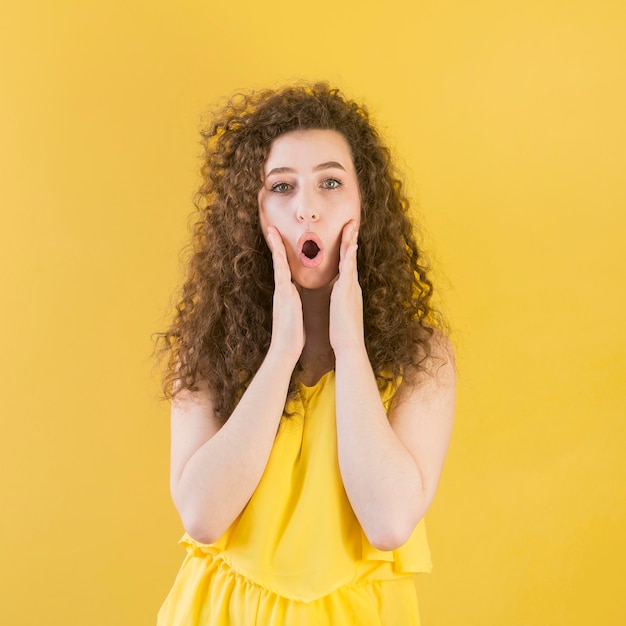 Young girl making some noise gesture