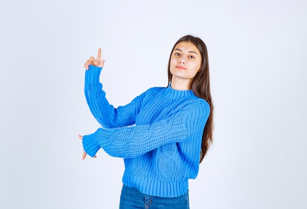 young girl model pointing up and down.