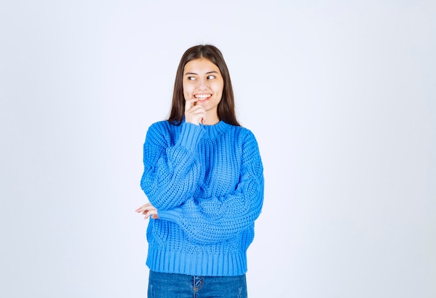 young girl model smiling and looking away.