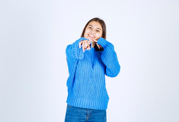 young girl model standing and posing on white-gray.