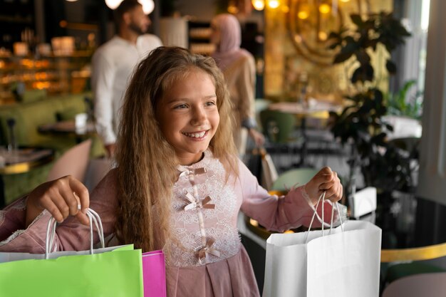 Young girl out for a shopping session with her parents