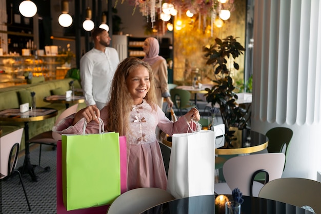 Young girl out for a shopping session with her parents