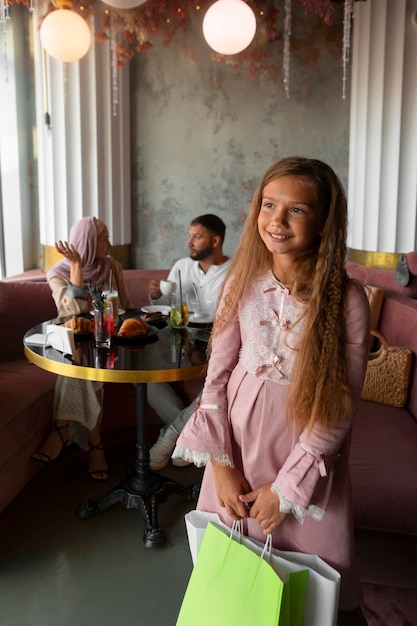 Young girl out for a shopping session with her parents