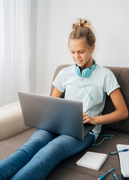 Young girl paying attention to online class