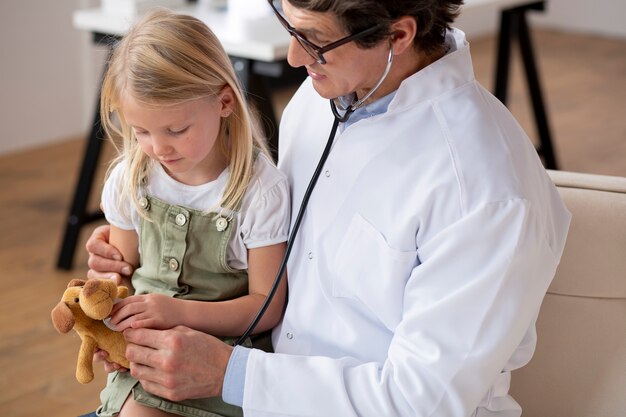 Young girl at the pediatrician for a consultation with her doctor